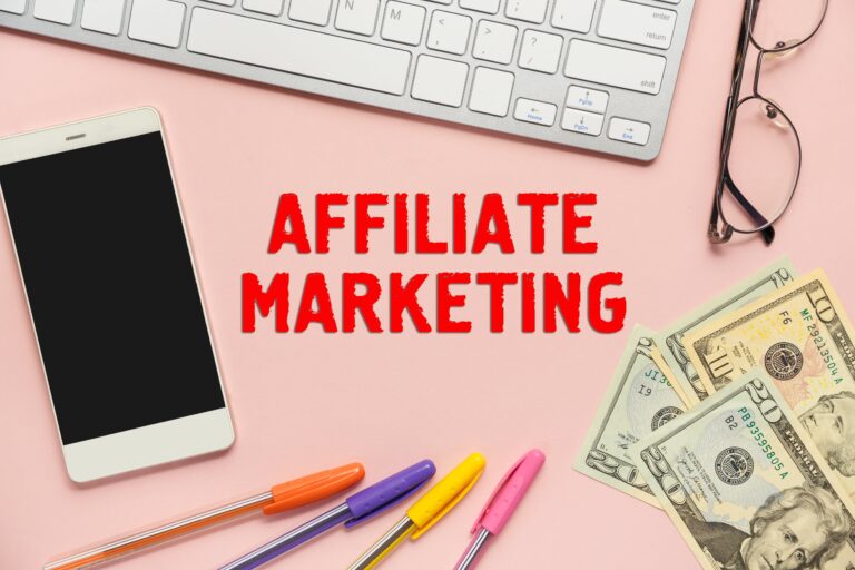 a phone, a keyboard and money - affiliate marketing desk