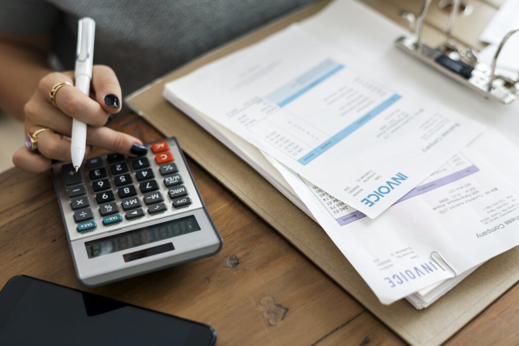 a woman calculating an invoice