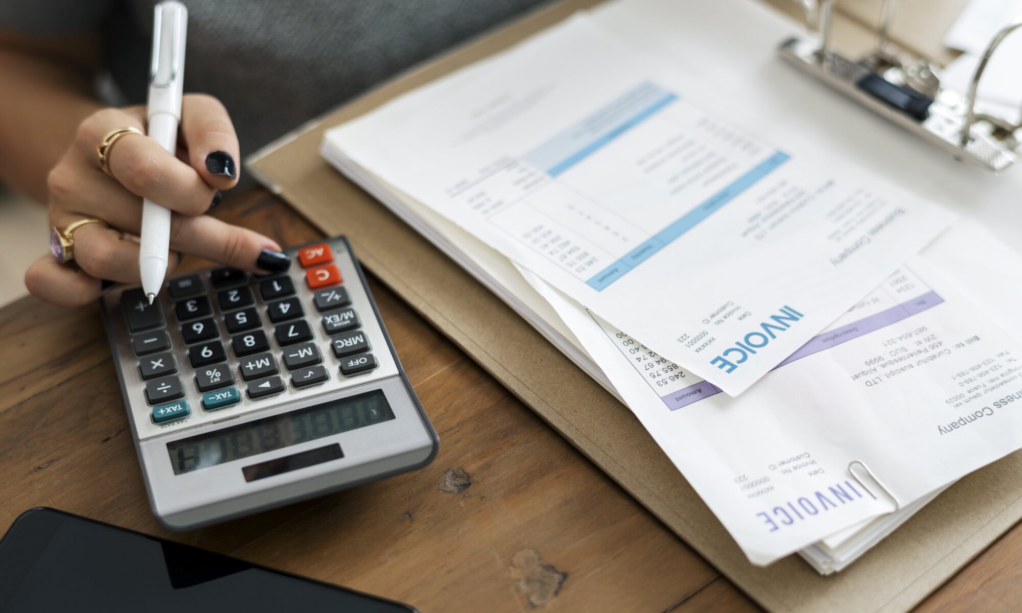 a woman calculating an invoice