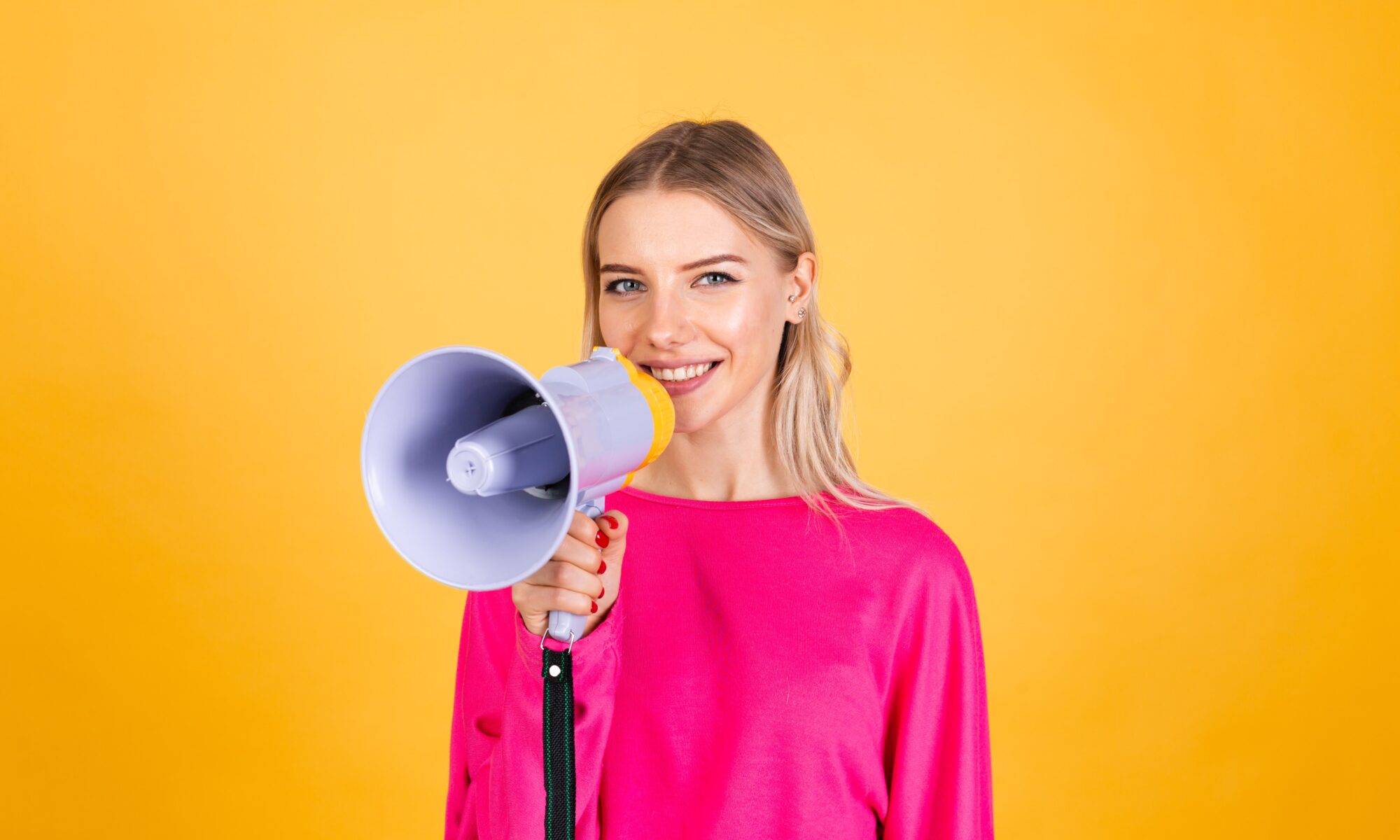 A woman holding a loudspeaker