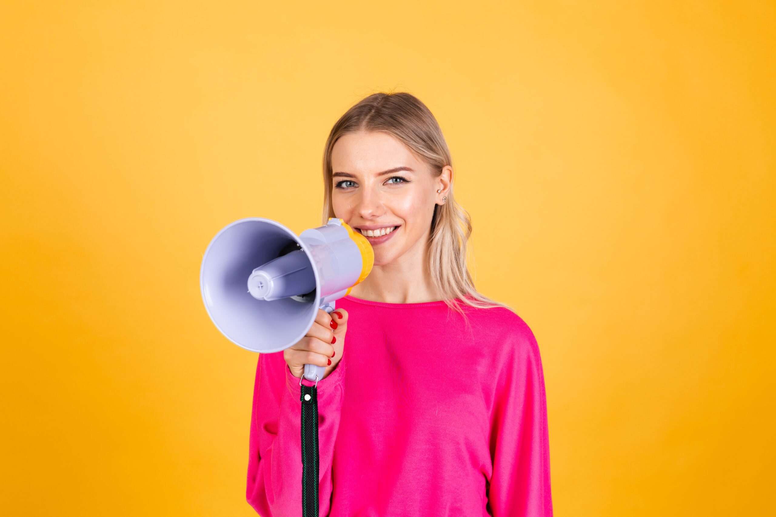 A woman holding a loudspeaker